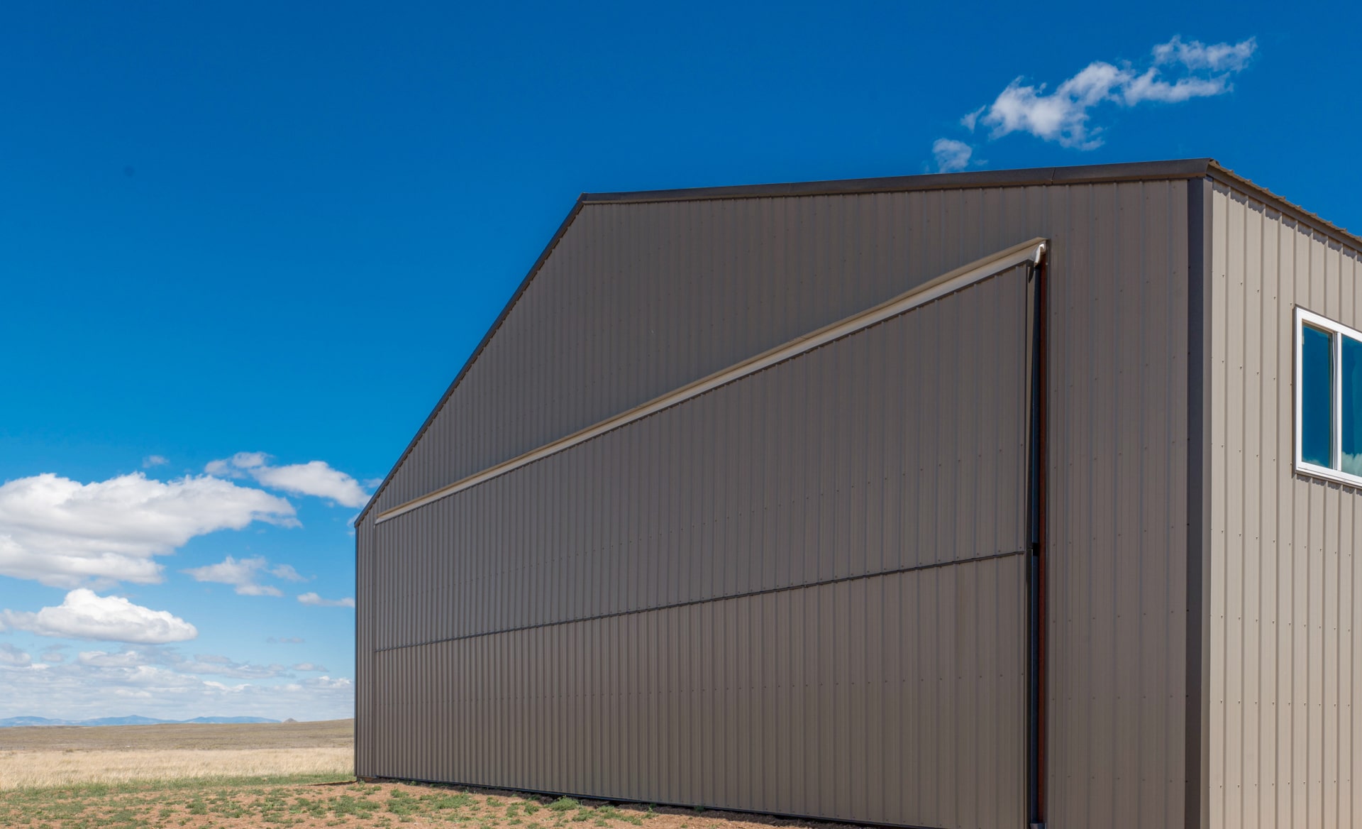 Large building with tan metal siding in Hays KS