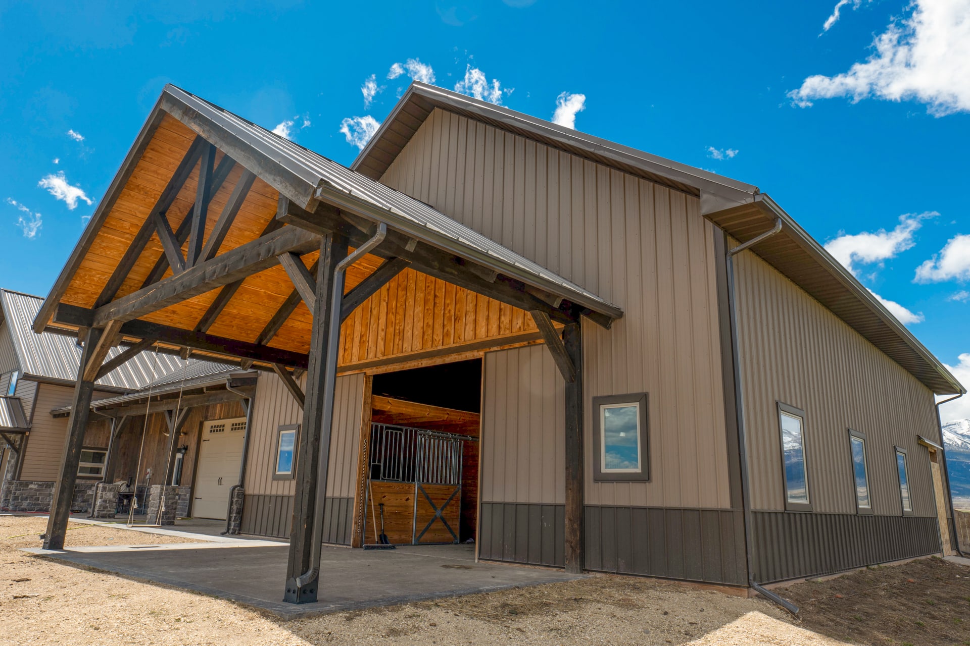 Large stable garage and house with metal siding roofing in Thornton CO